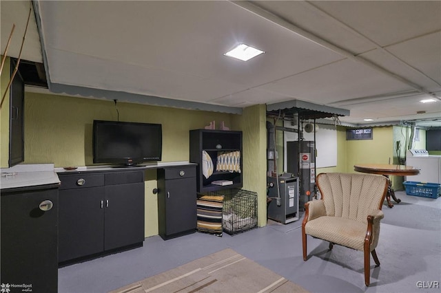 interior space featuring washing machine and dryer and water heater