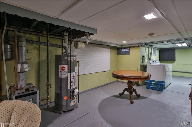 basement with washer and clothes dryer and water heater