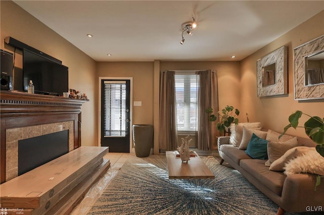 tiled living room featuring a tile fireplace