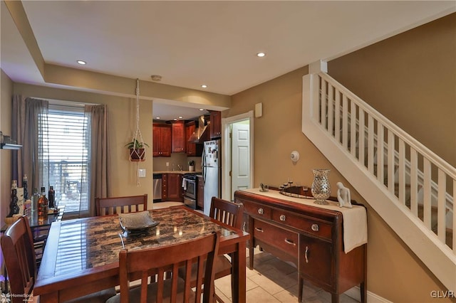 dining area featuring light tile patterned floors