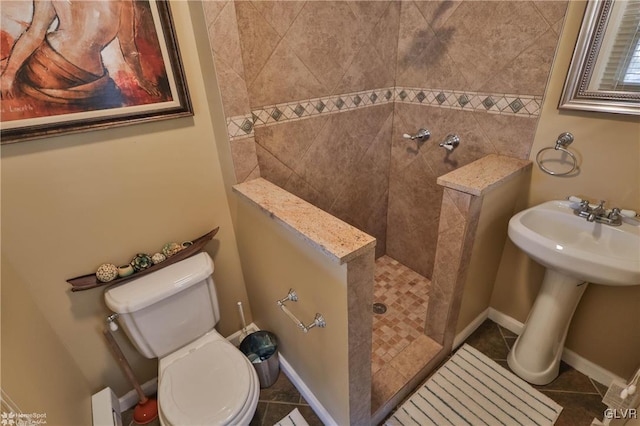 bathroom featuring toilet and tile patterned floors