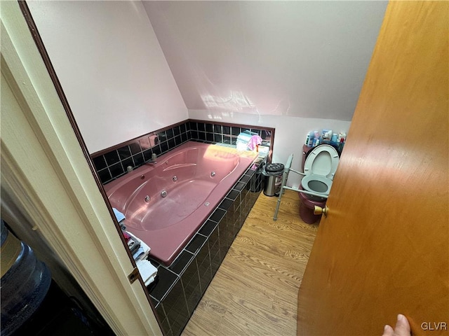 bathroom featuring a bathing tub and hardwood / wood-style flooring