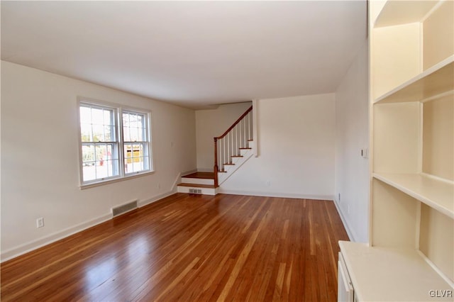 unfurnished living room with hardwood / wood-style floors