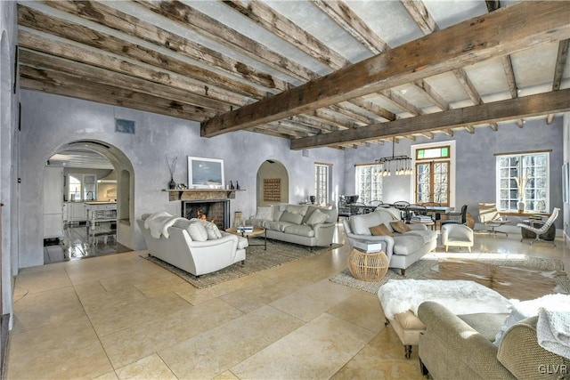 living room featuring beam ceiling