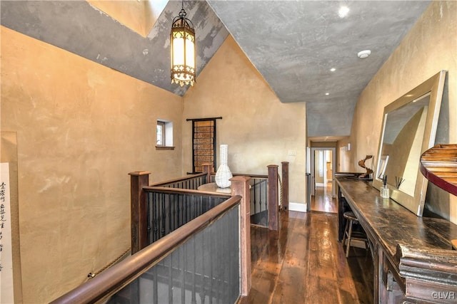 hallway with dark hardwood / wood-style floors