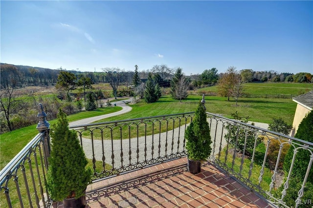 balcony featuring a rural view