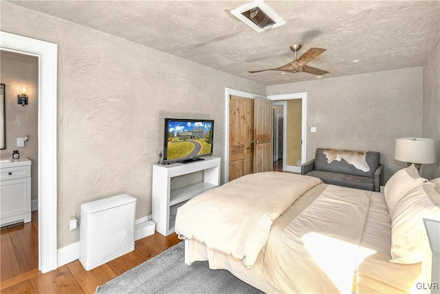 bedroom with wood-type flooring and ceiling fan