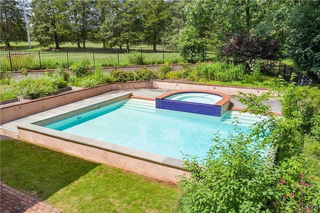 view of pool featuring an in ground hot tub