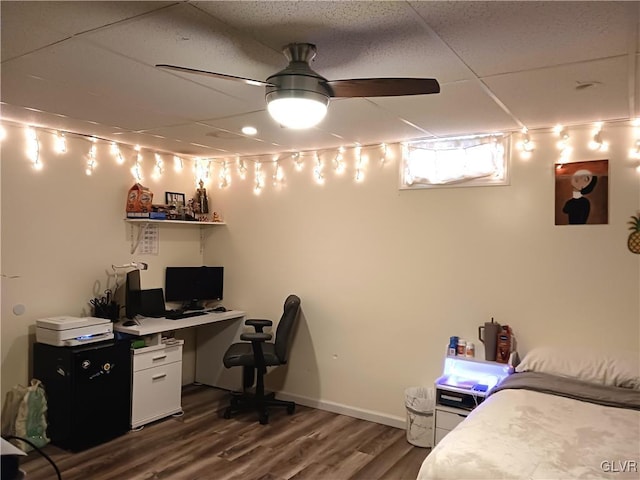 bedroom with ceiling fan and dark wood-type flooring