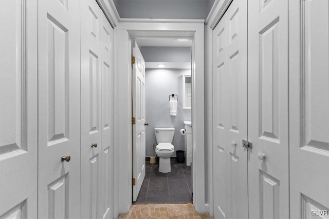 bathroom featuring tile patterned flooring and toilet