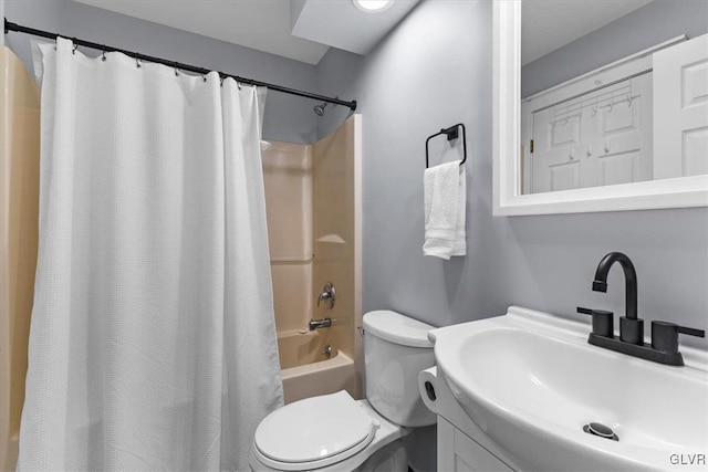 full bathroom with vanity, shower / bath combo, and toilet