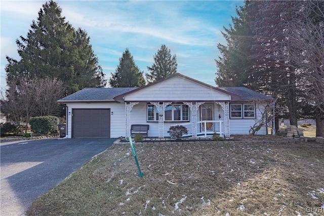 ranch-style home featuring a garage and a porch