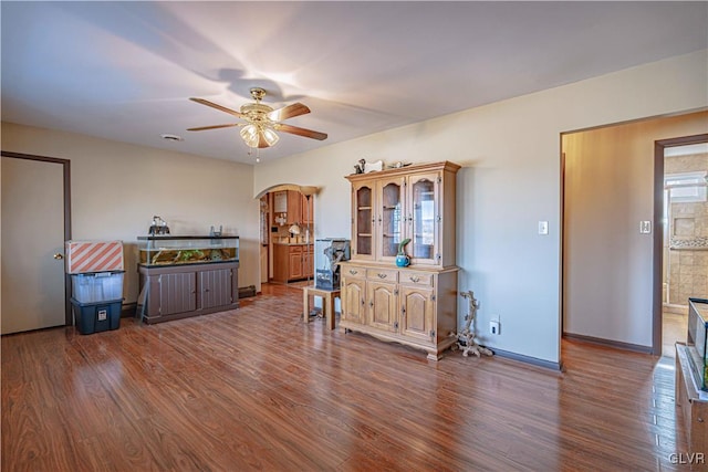 interior space with ceiling fan and hardwood / wood-style flooring