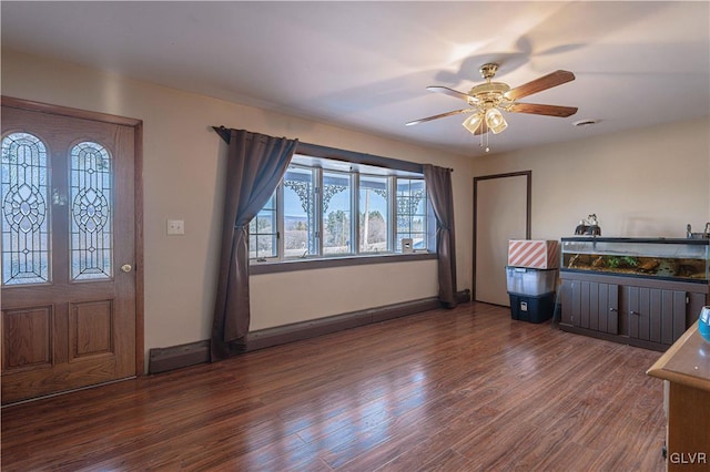 foyer featuring ceiling fan and dark hardwood / wood-style floors