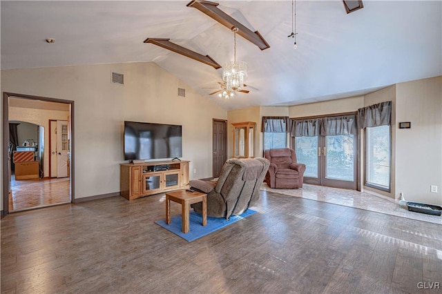 living room with vaulted ceiling, wood-type flooring, and french doors