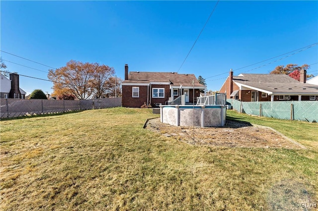 view of yard featuring a fenced in pool