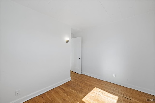 spare room featuring light wood-type flooring