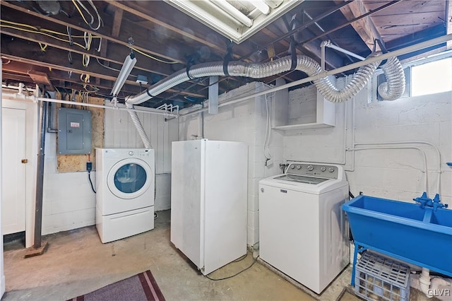 washroom with separate washer and dryer, sink, and electric panel