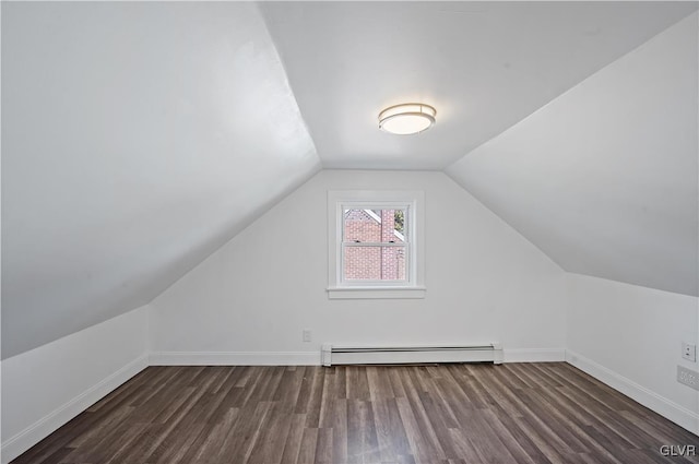 bonus room with dark hardwood / wood-style floors, lofted ceiling, and a baseboard heating unit