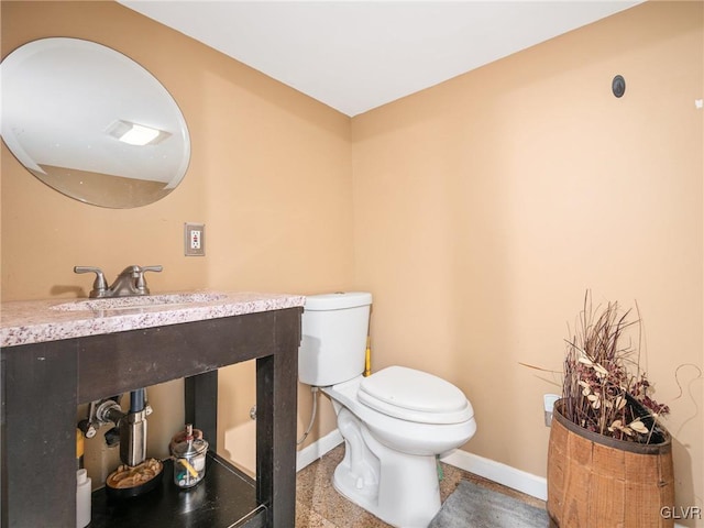 bathroom with toilet and sink