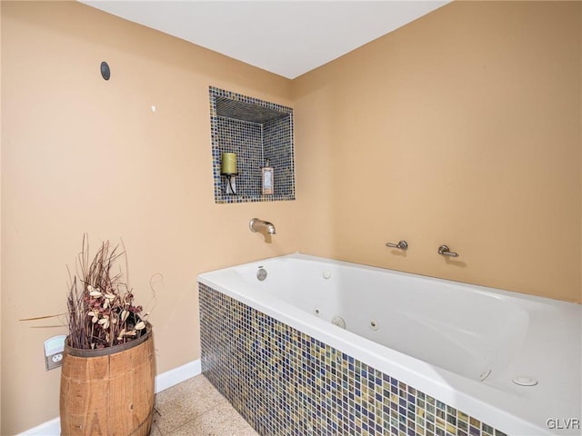 bathroom with tiled bath