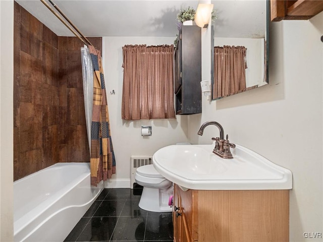 full bathroom featuring radiator heating unit, shower / tub combo with curtain, vanity, and toilet