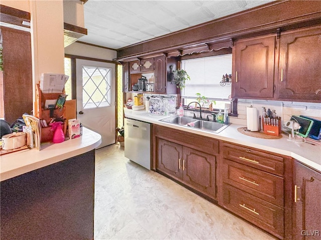 kitchen featuring stainless steel dishwasher and sink