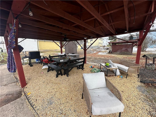 view of patio featuring a storage unit