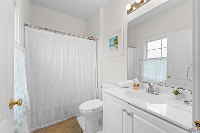 full bathroom featuring toilet, vanity, tile patterned floors, and shower / bathtub combination with curtain