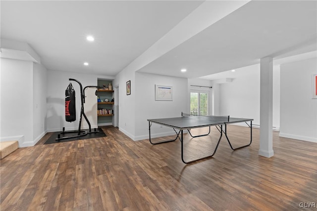 rec room with dark hardwood / wood-style floors