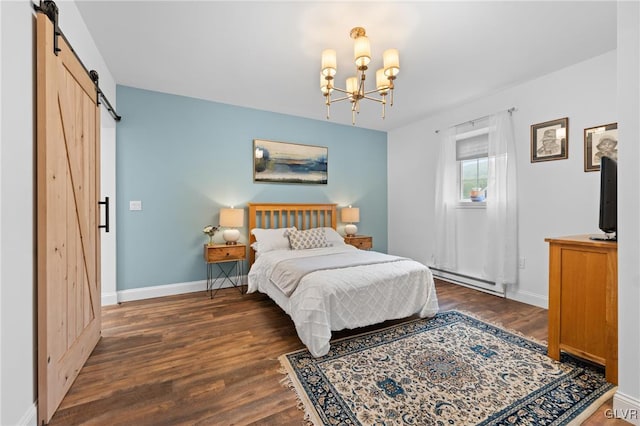 bedroom with a chandelier, a barn door, dark wood-type flooring, and a baseboard heating unit