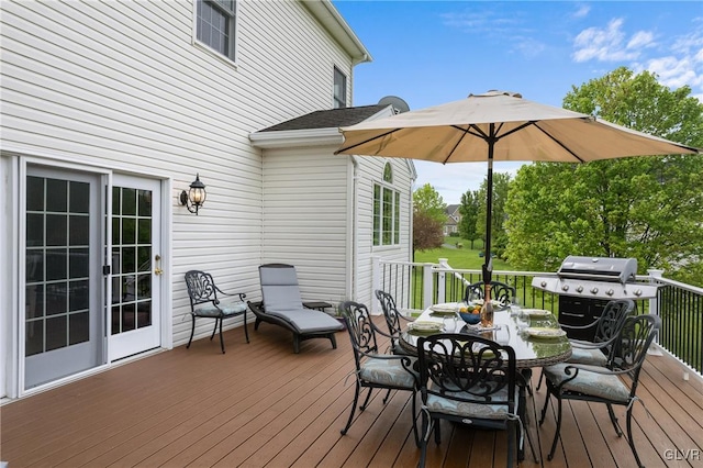 wooden deck featuring area for grilling