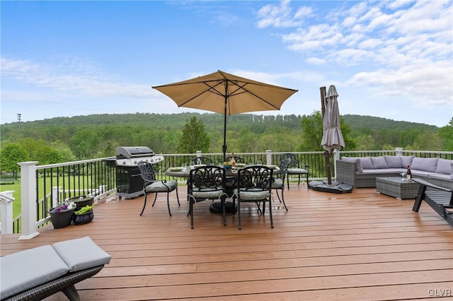 wooden deck featuring outdoor lounge area and grilling area