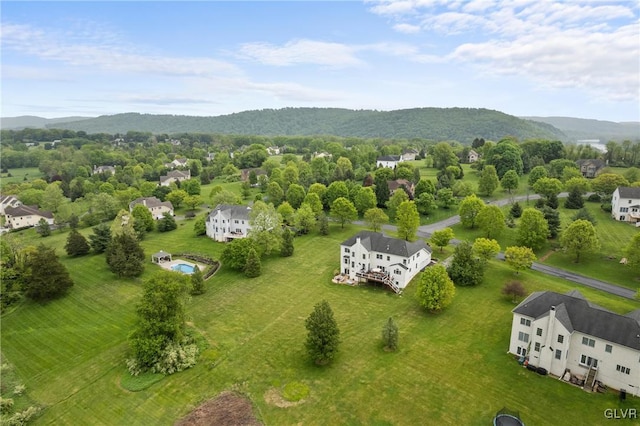 birds eye view of property with a mountain view