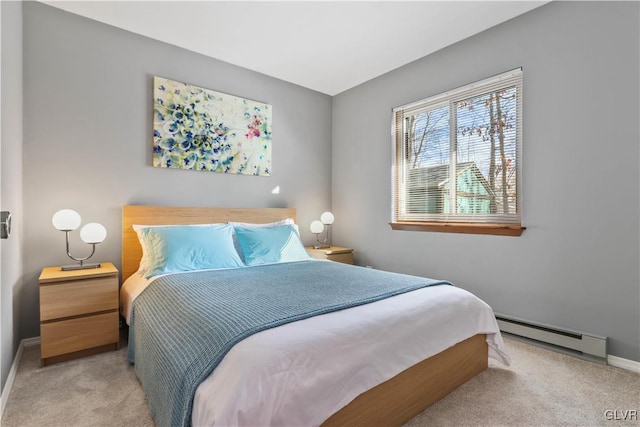 bedroom featuring light carpet and a baseboard radiator