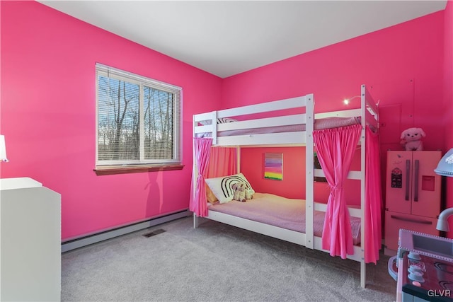 bedroom with carpet and baseboard heating