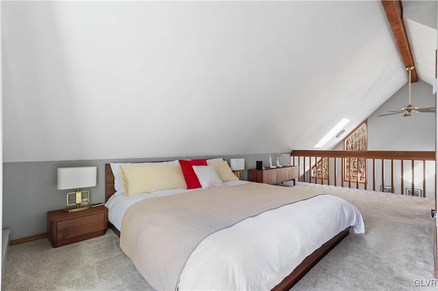 bedroom featuring lofted ceiling with beams, ceiling fan, and light colored carpet