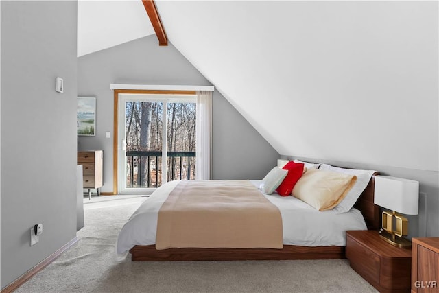 bedroom with lofted ceiling with beams and light colored carpet