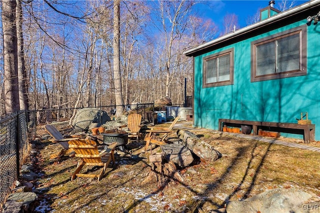 view of home's exterior featuring a fire pit