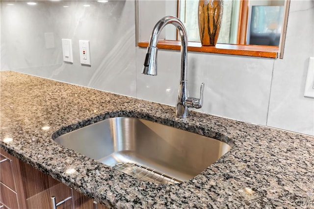 room details with stone countertops and sink