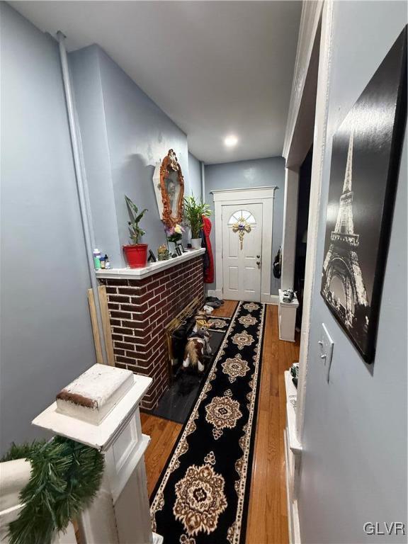 hallway featuring hardwood / wood-style floors