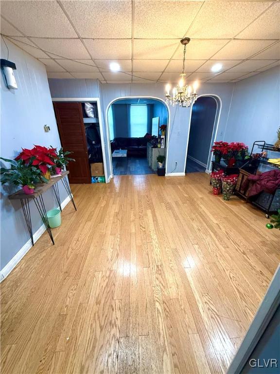 dining room with hardwood / wood-style floors and a notable chandelier