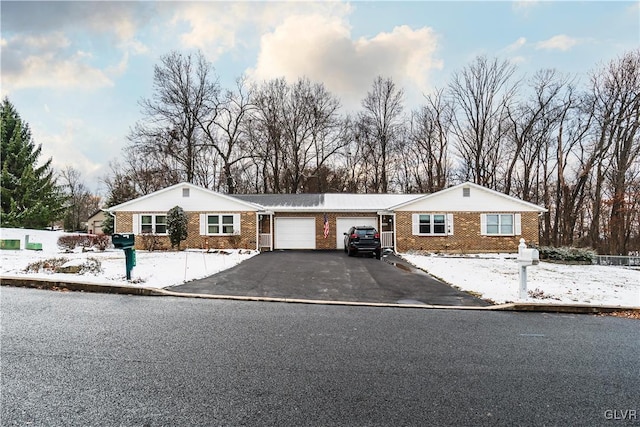 single story home featuring a garage