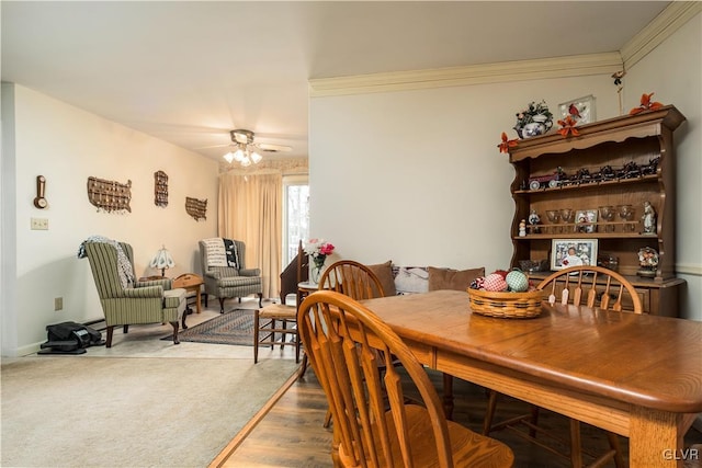 dining area with ceiling fan, hardwood / wood-style floors, and ornamental molding