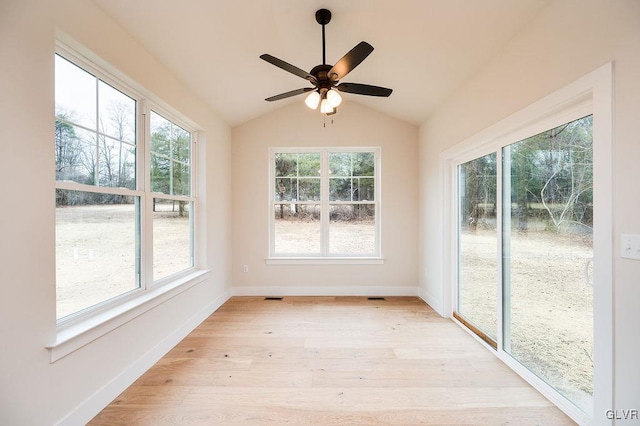 unfurnished sunroom featuring ceiling fan and lofted ceiling