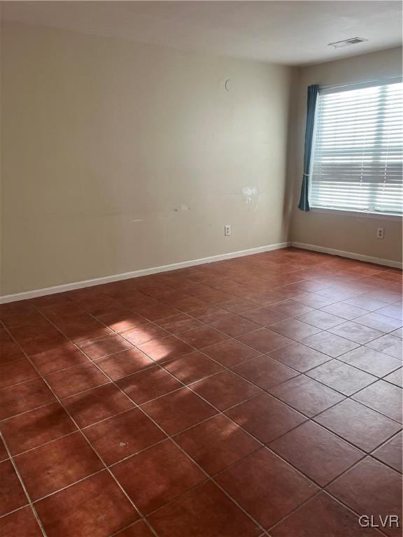 view of tiled spare room