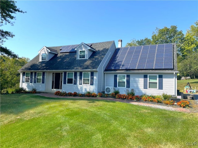 new england style home with ac unit, solar panels, and a front yard