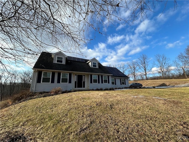 cape cod house with a front lawn