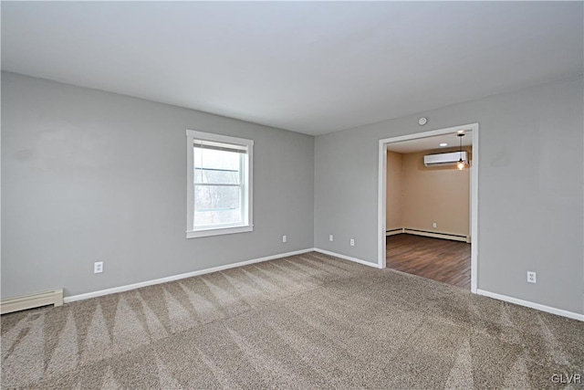 spare room with a wall mounted air conditioner, a baseboard heating unit, and dark colored carpet