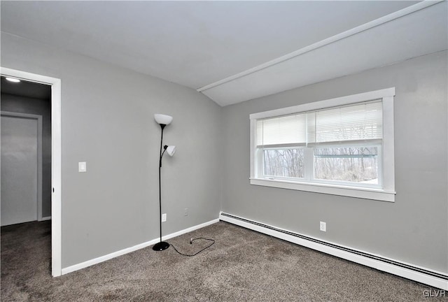 carpeted spare room with vaulted ceiling and a baseboard radiator